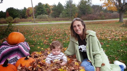 Playing in the leaves with Grandma